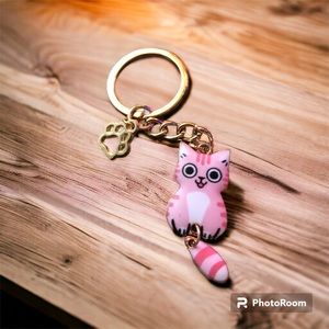 Cat charm.  Pink smiling cat